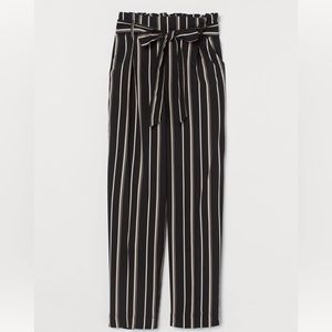 Pinstripe Ankle-length high waist paper-bag pants.